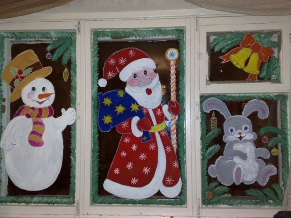Beautiful painting of the window for the New Year in kindergarten