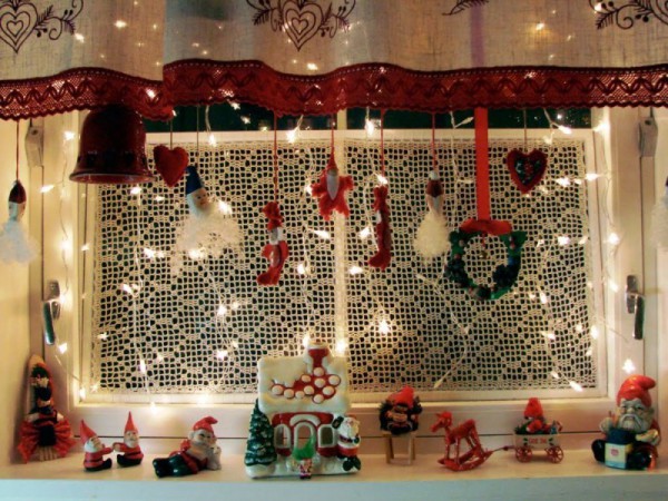 Decorating windows with garlands for the New Year
