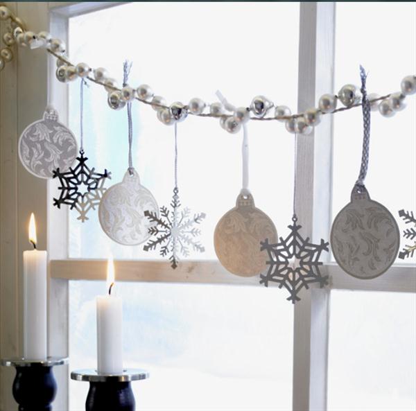 Decorating windows with original garlands for the New Year